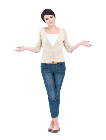 A young woman gesturing quizzically against a white background - full length