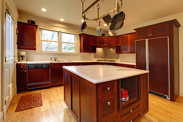 istock Luxury cherry kitchen with pot rack and island 477870365