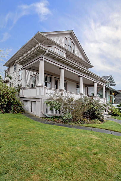 istock Large Victorian house with covered porch 477870369