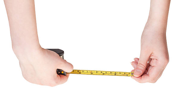 istock female hands with measuring tape isolated 477870778