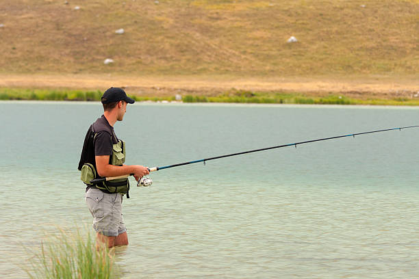 istock Fishing on the mountain lake 477871063