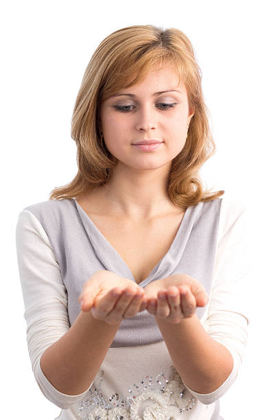istock beautiful girl advertises holding something 477871685