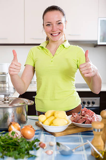 istock girl preparing beef ragout 477871964