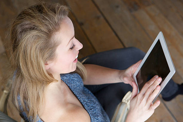 istock Happy woman with tablet 477872273