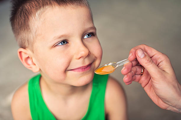 istock Little boy taking a medicine 477872699