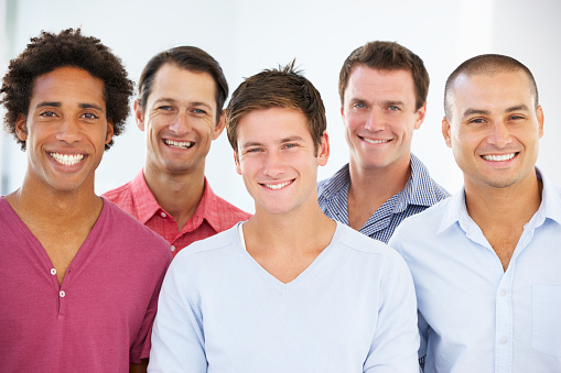 Group Of  Businessmen In Casual Dress Smiling At Camera