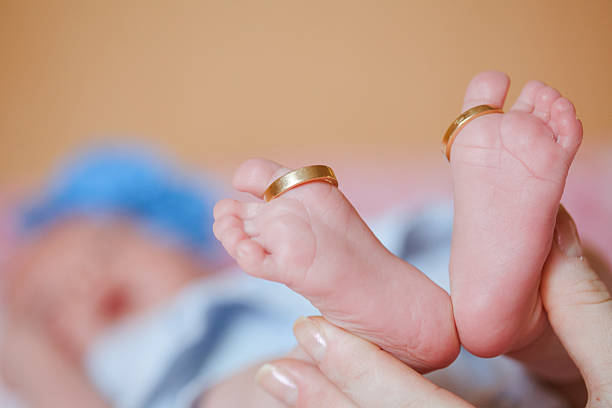 istock adorable newborn baby feet 477873456