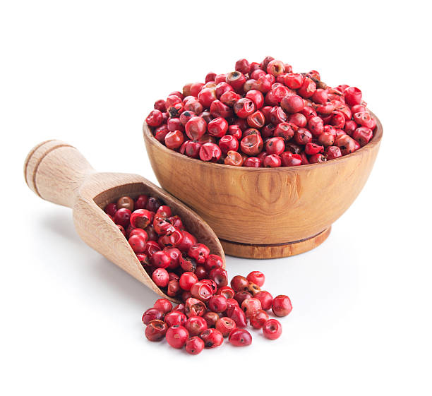 pink peppercorn isolated on white pink peppercorn isolated on white background pink pepper spice ingredient stock pictures, royalty-free photos & images