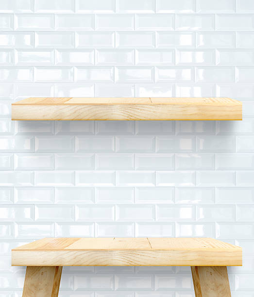 istock Empty Wooden Table top and shelf at white tile wall 477875704