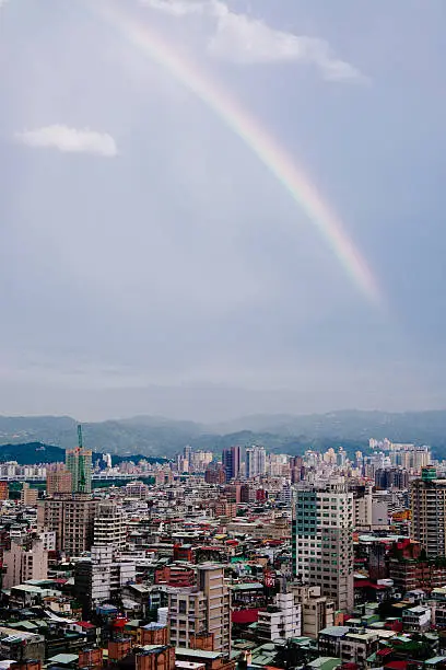 Rainbow crossing the city