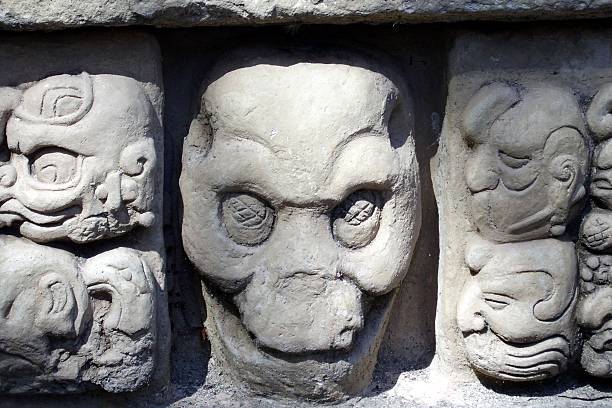 istock Carved in stone skull, Copan Honduras 477878561