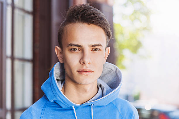 istock Young man portrait outdoors 477879956