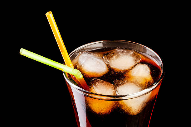 istock fresh cola juice and ice cubes splash in a glass 477881581
