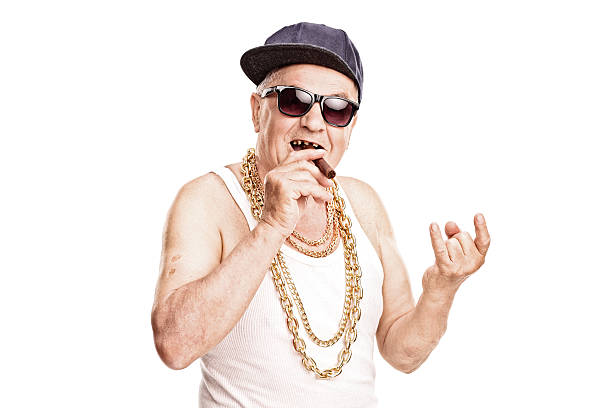 istock Senior rapper smoking a cigar and making hand sign 477881752