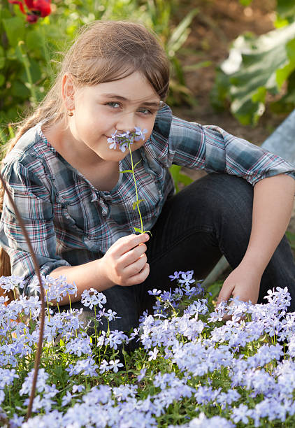istock Girl in garden 477883249