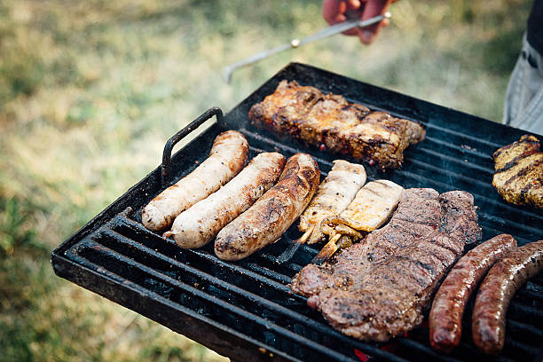 istock barbecue grill with german sausages and steaks 477883962