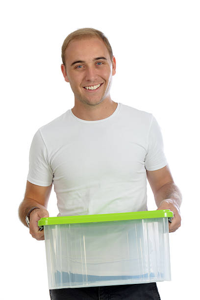istock One positive smiling young man holding an en empty container 477884486