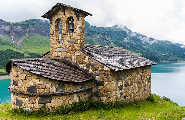 istock France. Lac de Roselend. The chapel 477884738