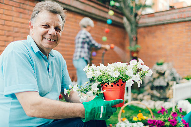 istock Senior Couple Gardening Together. 477885088