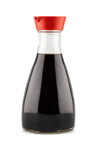 soy sauce bottle with red cap isolated on white background