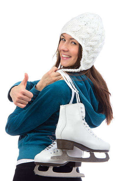 istock woman with  ice skates thumb up 477885331