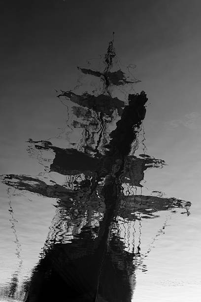 Ghostship Black and white photo of the reflection of a tallship, creating a ghostship. Extra contrast added ghost ship stock pictures, royalty-free photos & images