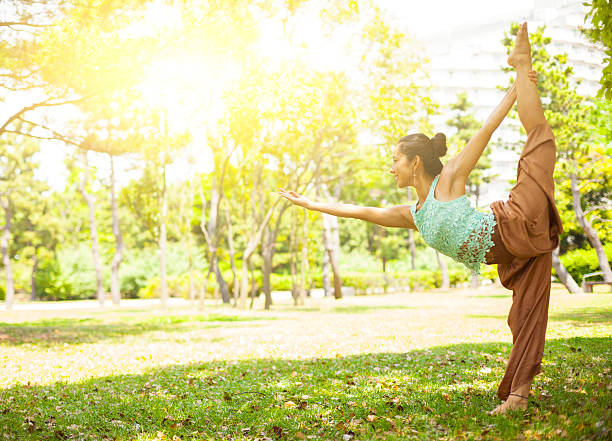 istock Young asian woman practicing yoga 477885644