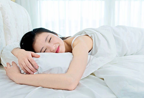 istock Beautiful young asian woman sleeping 477886566