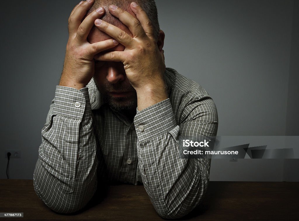 Sad man Headache. Expressions, feelings and moods. Man suffering from headache Adult Stock Photo