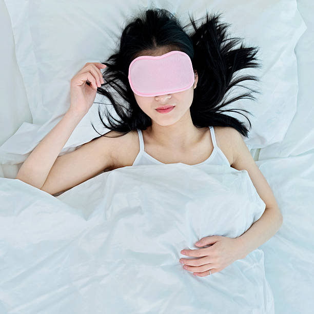 istock woman sleeping in sleep mask 477889474