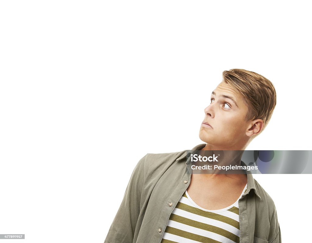 I'm a bit shocked at that! Studio shot of a shocked young man looking at copyspace 18-19 Years Stock Photo