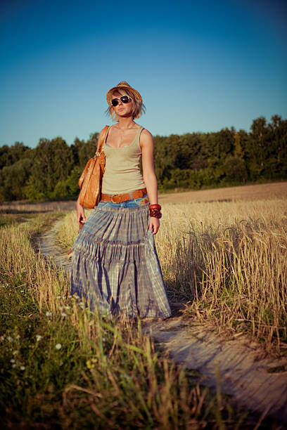 istock young woman on wheat field 477892139