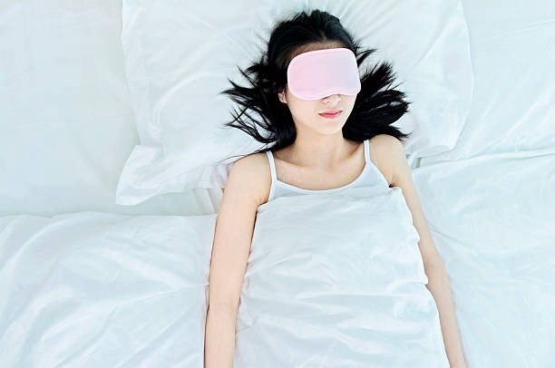 istock woman sleeping in sleep mask 477893062