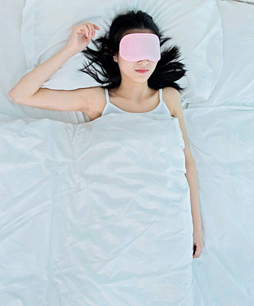 istock woman sleeping in sleep mask 477893094