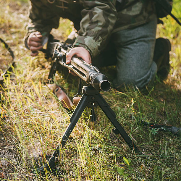 istock Unidentified re-enactor dressed as German soldier machine-gunner 477893716