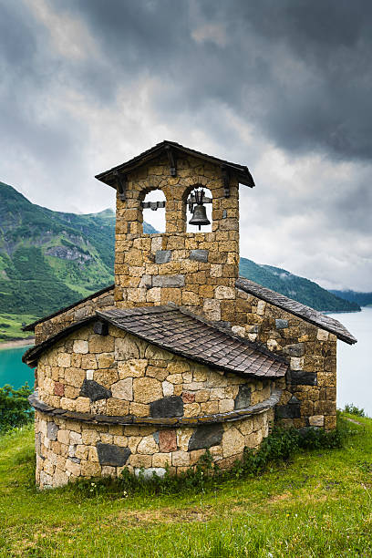 istock France. Lac de Roselend. The chapel 477895278