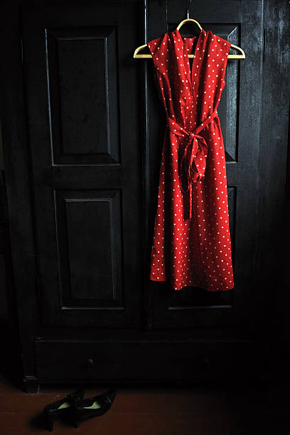 istock Mothers  red dress in a white dots 477895826