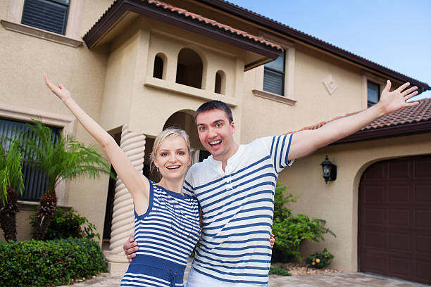 istock Happy couple celebrating new house 477897555