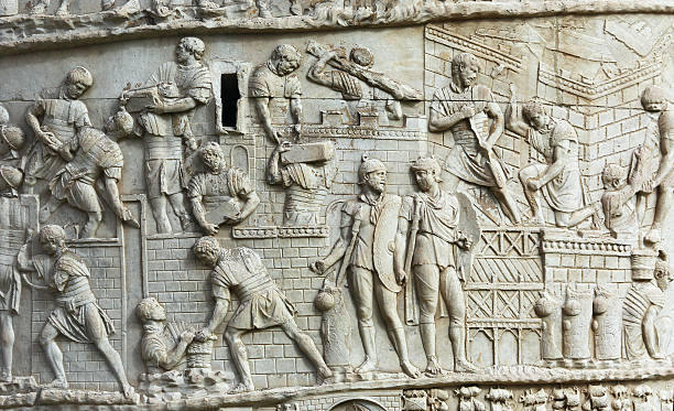 Detail from Trajan's Column in Rome Detail from Trajan's Column representing roman soldiers building a defensive wall. roman empire stock pictures, royalty-free photos & images