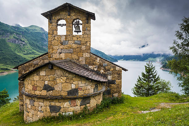 istock France. Lac de Roselend. The chapel 477898468