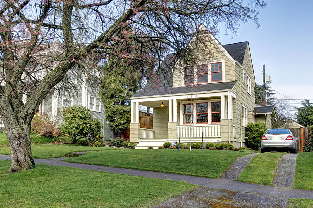 istock Small green house front exterior with car. 477898615