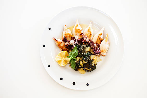 istock Fried squid and vegetables in lemon sauce 477898897