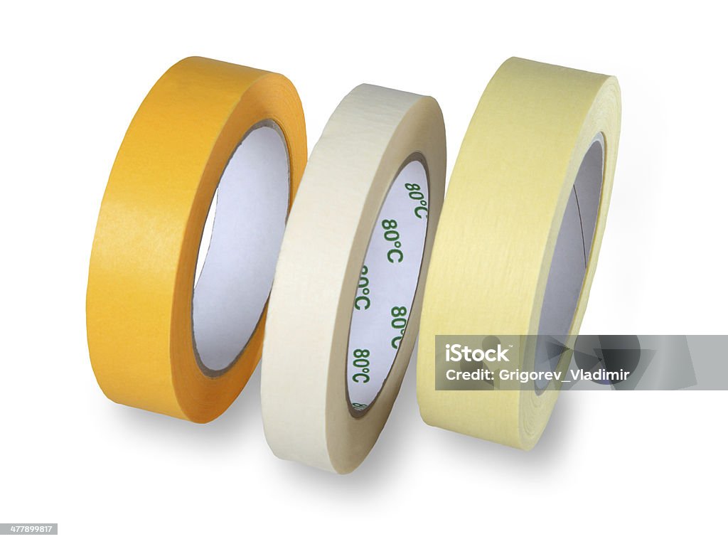 Three Rolls Of Narrow Paper Tape Yellow And Brown Stock Photo - Download  Image Now - Cut Out, Masking Tape, Adding Machine Tape - iStock