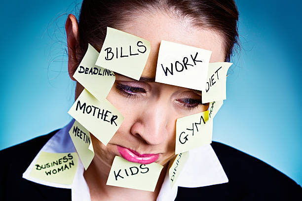 istock Exhausted, over-committed woman pouts unhappily 477900315