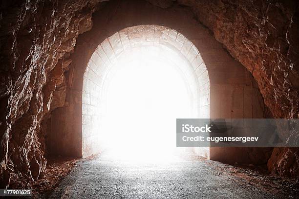 Glowing End Of Old Tunnel In Red Rock Stock Photo - Download Image Now - Abandoned, Cave, Construction Industry