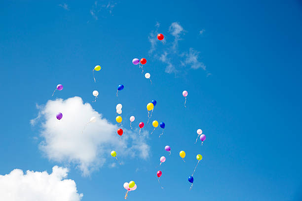 istock Flying colorful balls in the blue sky 477904678