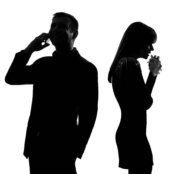 istock one man on phone turning his back to woman crying 477906247