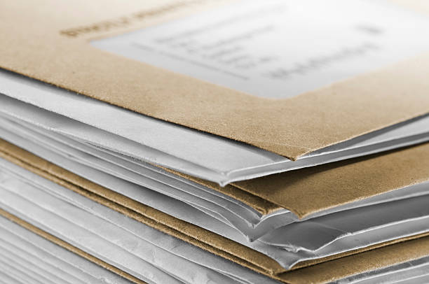 Pile of brown and white envelopes received in post