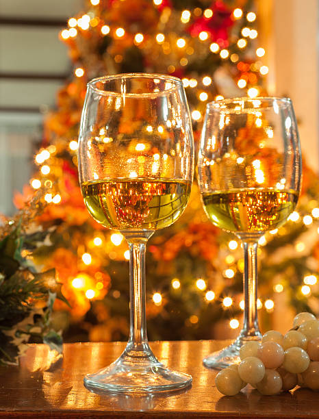 istock Wine Glasses against Christmas Lights 477907317