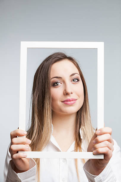 istock Woman framing with white frame 477907713